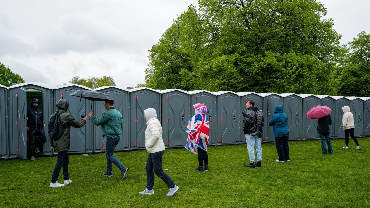 People wait for portaloos