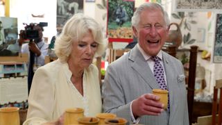 Prince Charles, Prince of Wales and Camilla, Duchess of Cornwall visit a chocolate house in Grenada, on March 23, 2019 in Saint George's, Grenada