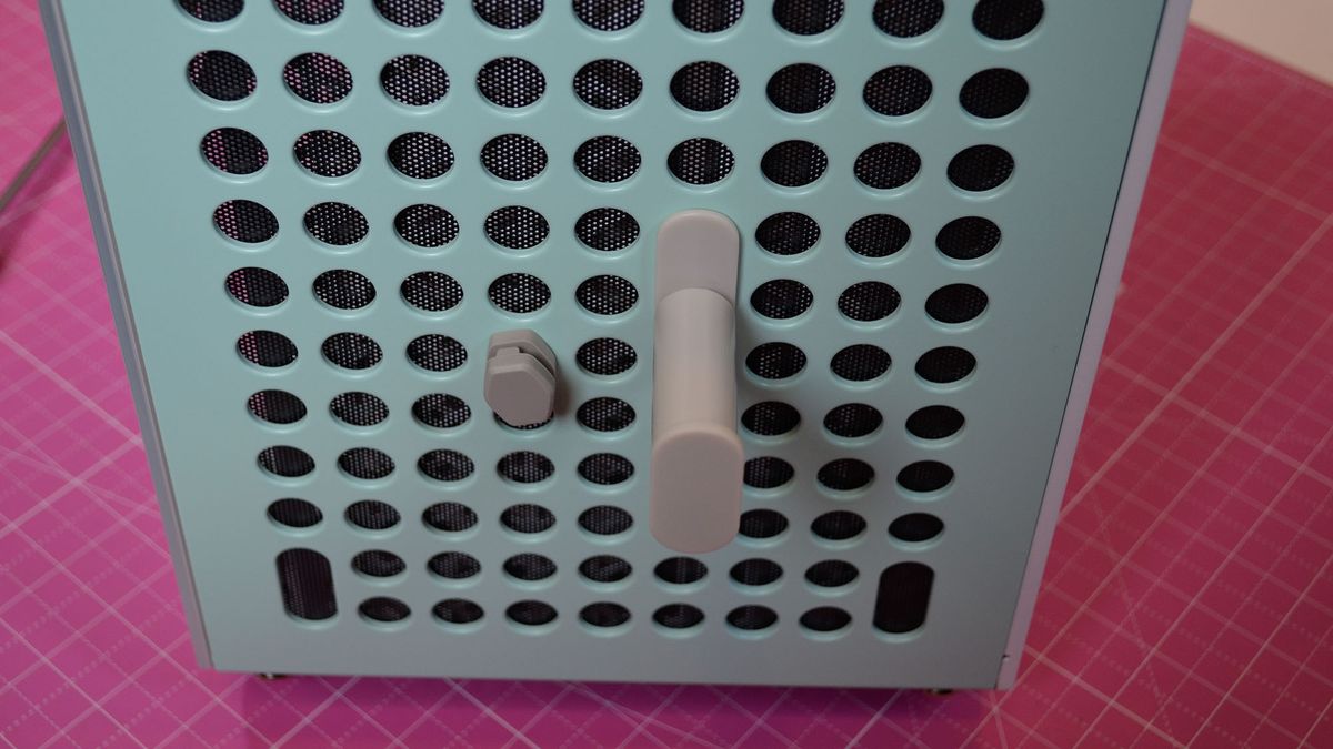 Attachments for the Cooler Master Qube 500 PC case inserted into its front panel