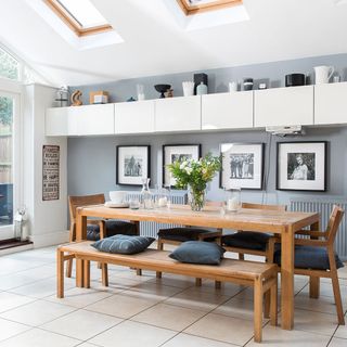 dining area with grey wall and frames