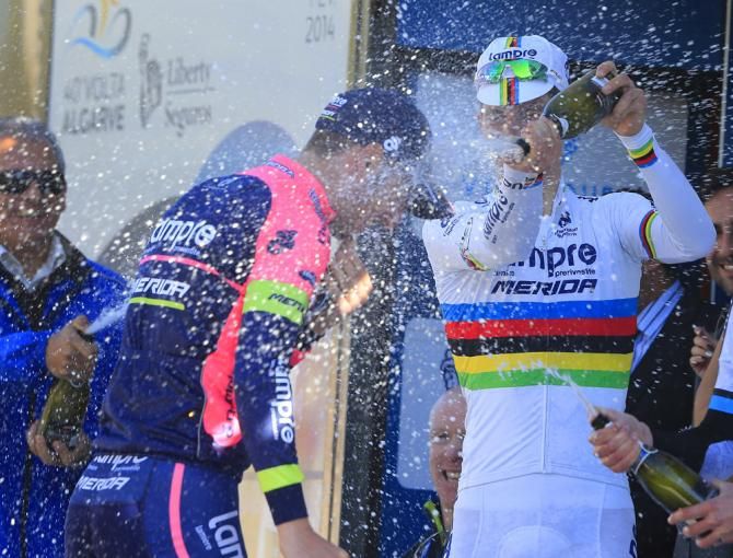 Celebration time on the podium as Rui Costa douses his Lampre-Merida teammate and stage 1 winner Sacha Modolo with champagne