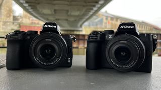 Nikon Z50 next to Nikon Z50 II under bridge