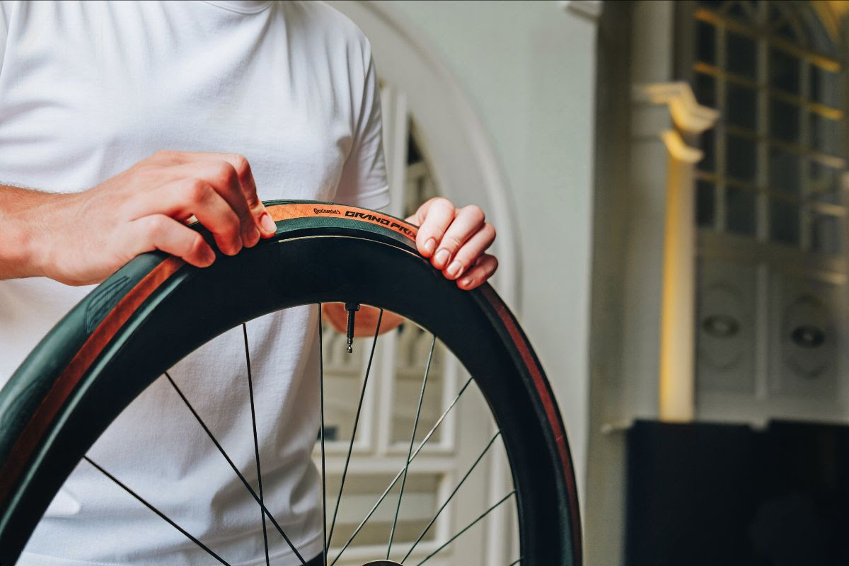 A Continental Grand Prix tyre being fitted to a rim