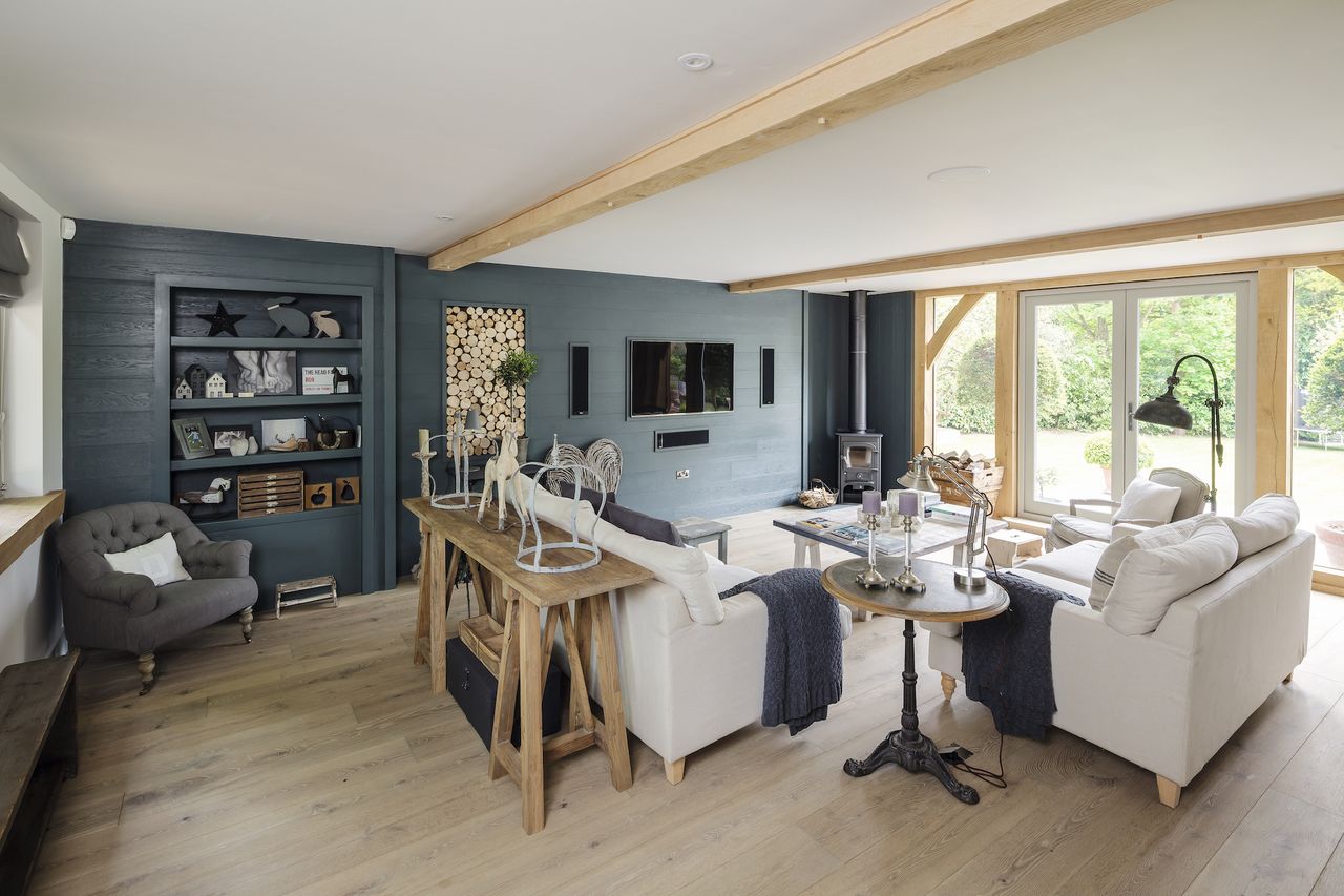 blue living room with oak frame and wall panelling