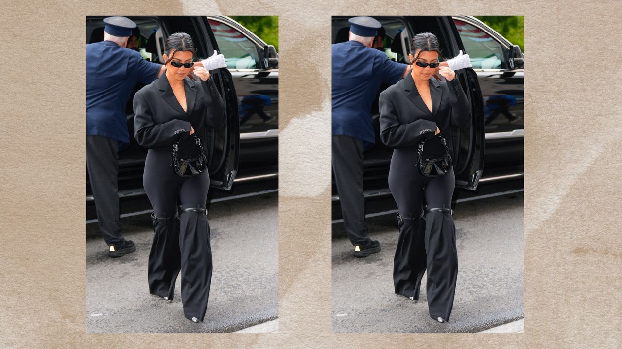 Kourtney Kardashian in an all-black outfit on a brown background