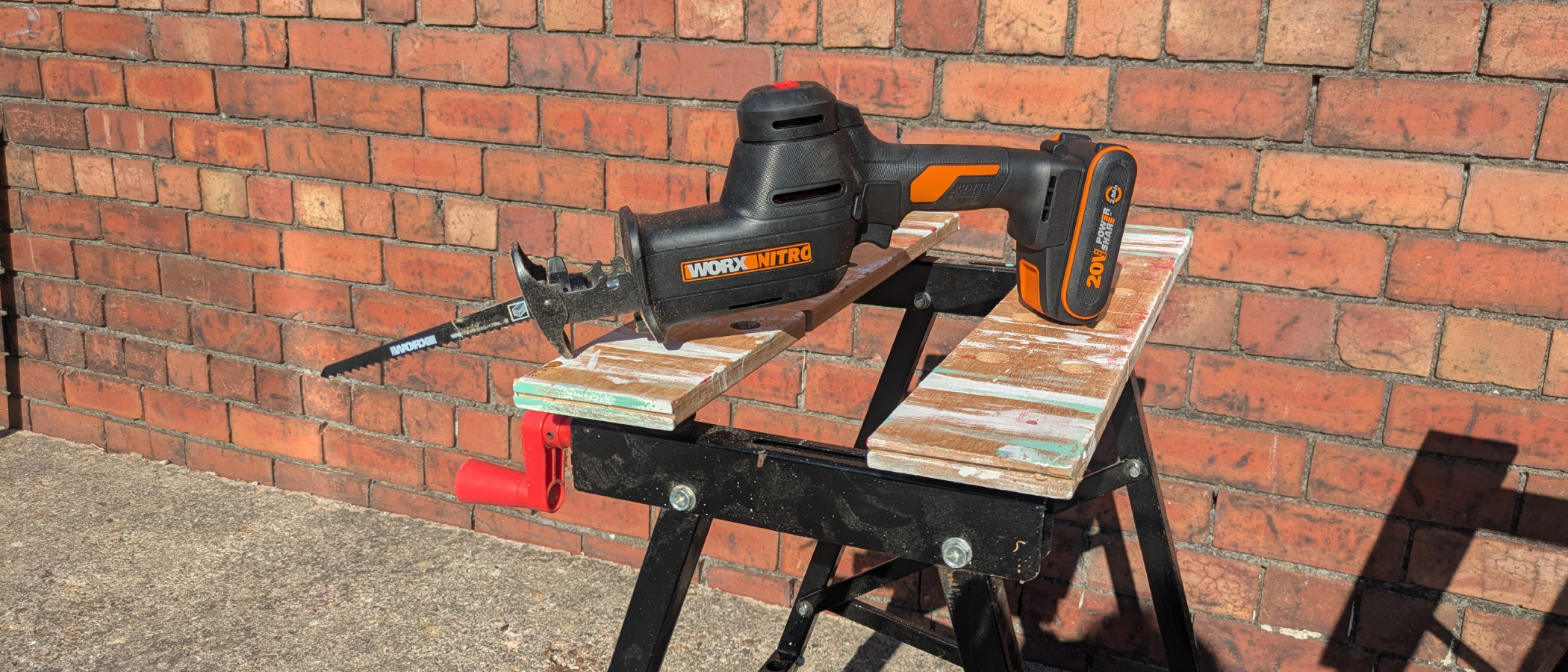 worx nitro reciproacting saw on work bench
