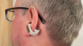 Bose Ultra Open Earbuds being worn by a man