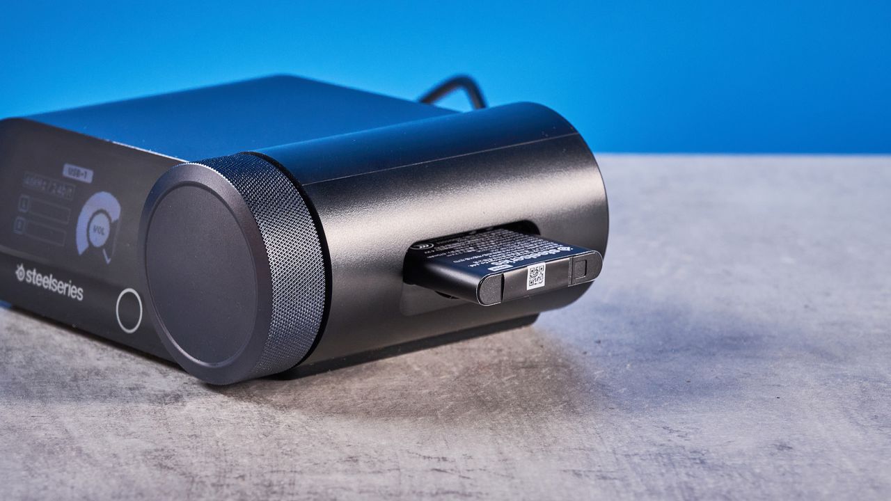 The SteelSeries Arctis Nova Pro Omni on a stone surface against a blue background