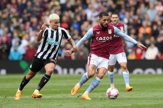 Aston Villa's Douglas Luiz and Newcastle's Bruno Guimaraes compete for the ball in a game in April 2023.