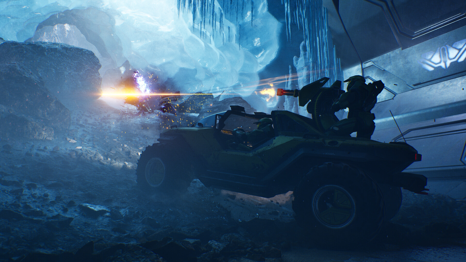 Halo Campaign Evolved: Two spartans driving a warthog through an icy cave.