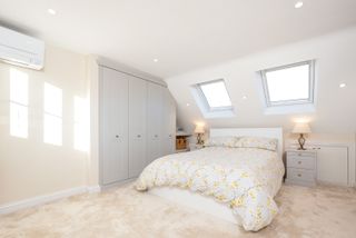 Neutral bedroom in loft conversion