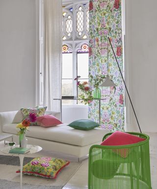 what color curtains drapes are best for summer, white modern living room with pretty floral drapes, white chaise longue, green modern chair, marble side table, bright floral cushions