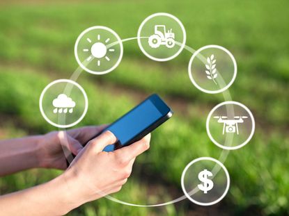Person Holding Smart Phone With Gardening App Symbols