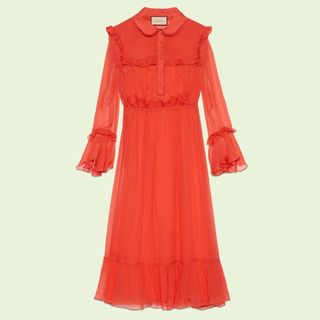 flat lay of red gucci chiffon dress