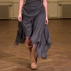 a model wearing uggs on the runway at anne sofie madsen