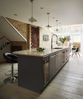 Long kitchen island with wine storage facility