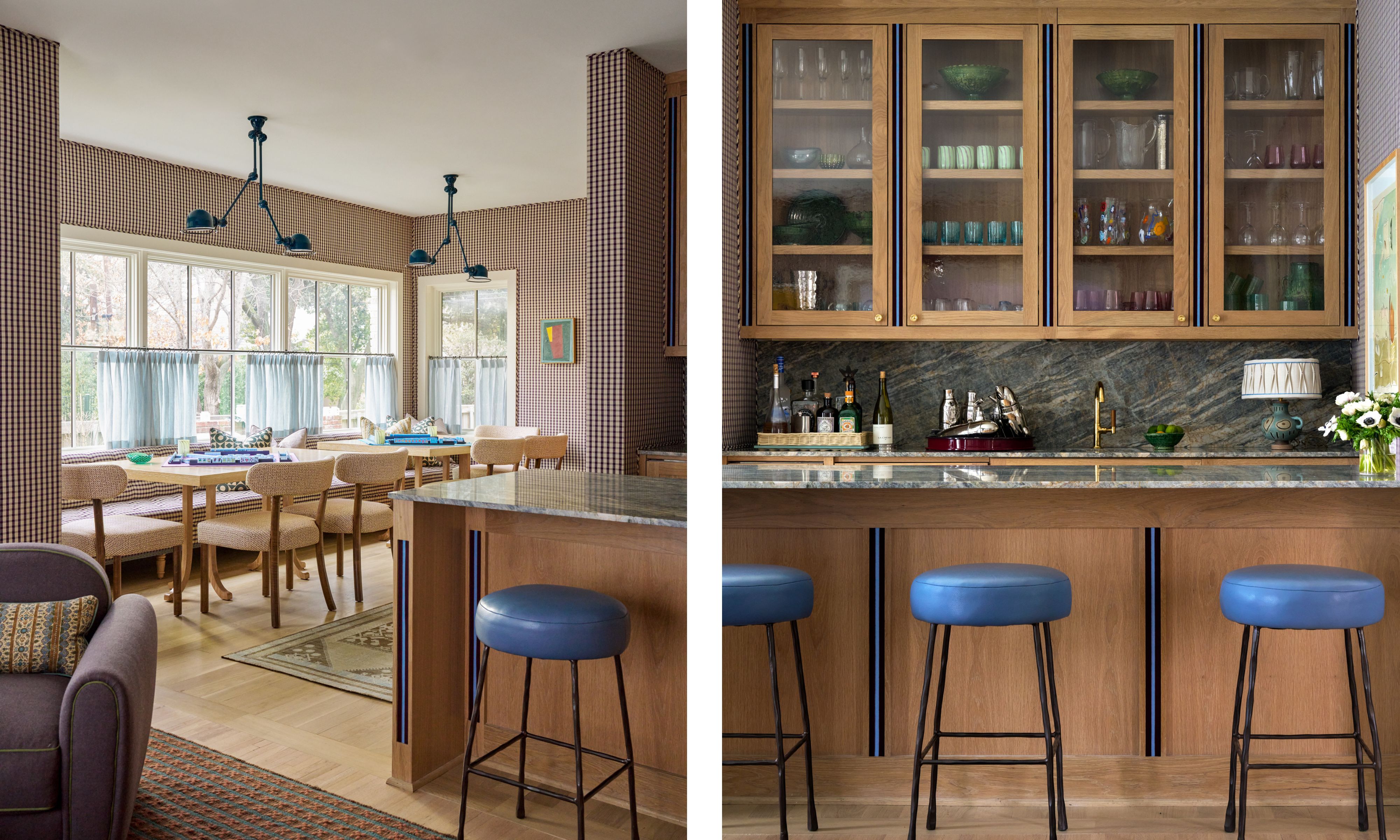 Split image: (left) A casual dining area with small checkered wallpaper, a built-in bench, woven chairs, and a long wooden table set under blue adjustable wall lamps, with light blue cafe curtains covering a wide window. (right) A sophisticated kitchen bar featuring light wood cabinets with glass fronts, a dark marble countertop, and three blue leather counter stools positioned in front of a wood-paneled island with blue trim.