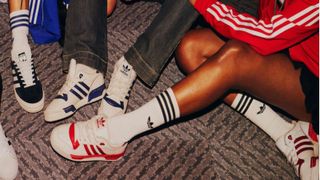 A group of people wearing Adidas trainers