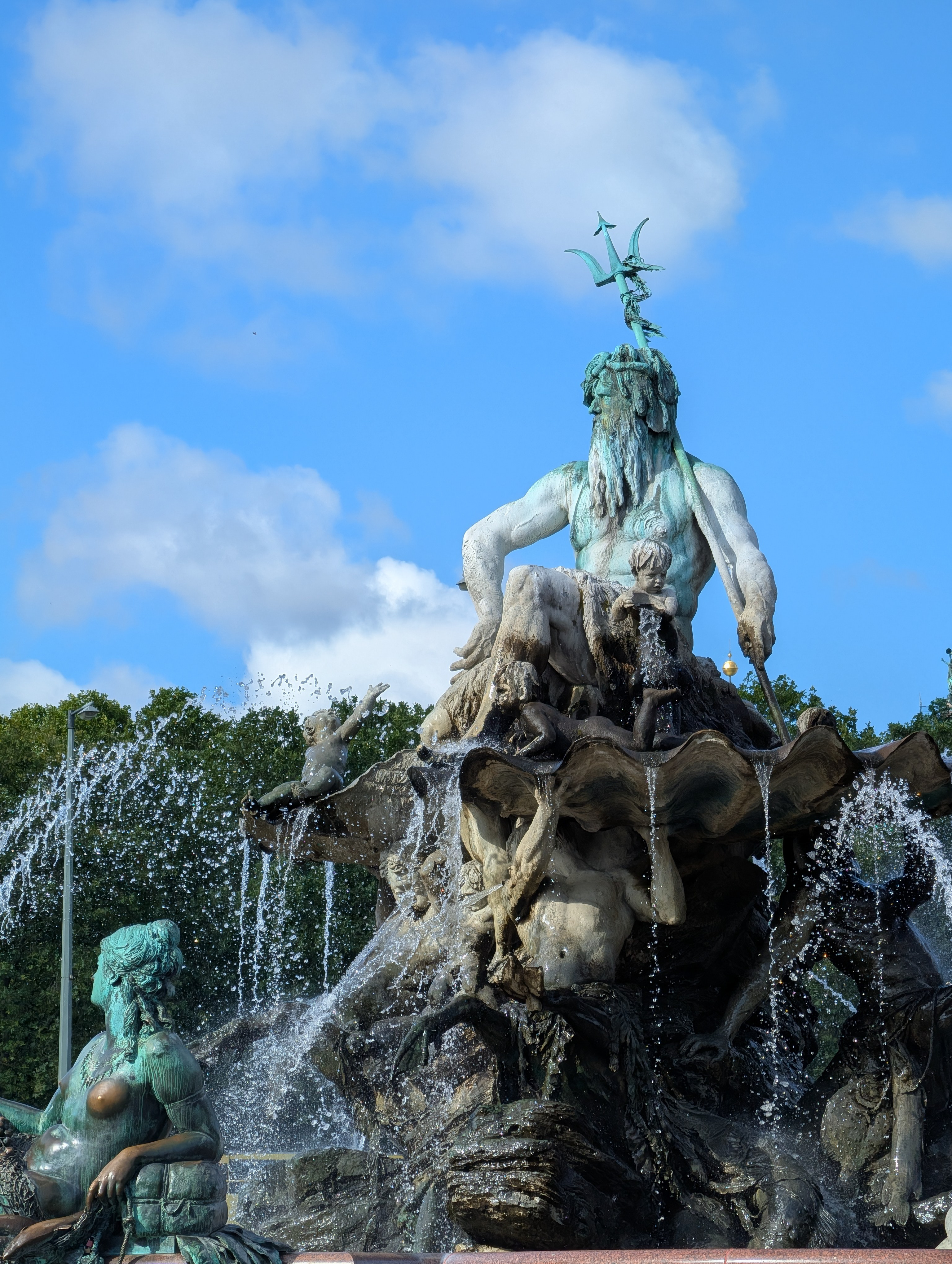 A statue surrounded by a fountain