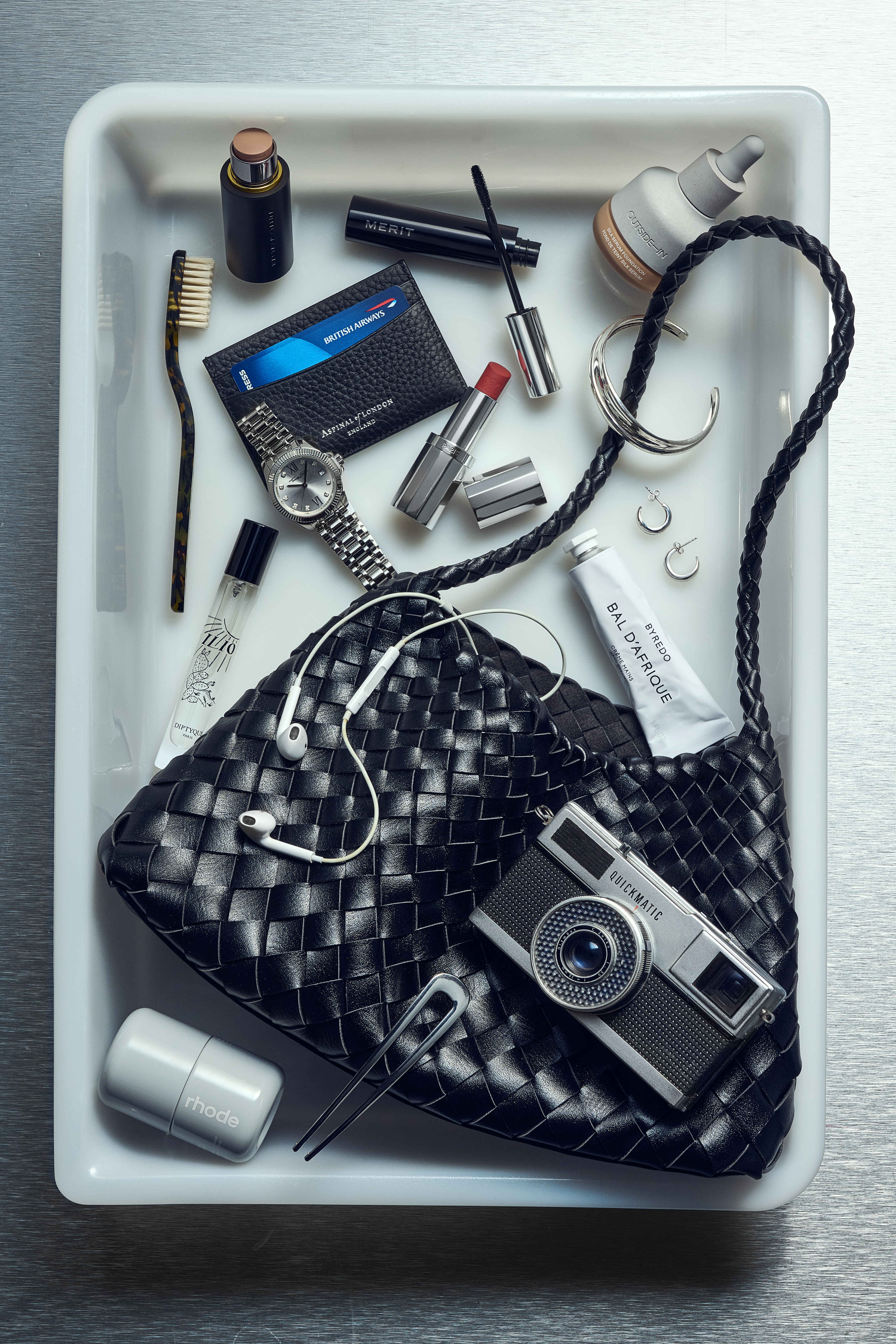 Eleanor's airport tray with a black and white colour scheme with a monochromatic city break aesthetic