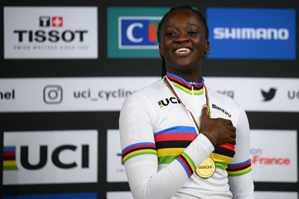 Frances Taky Marie Divine Kouame celebrates on the podium with her gold medal after winning the Womens 500m time trial final during the UCI Track Cycling World Championships at the Velodrome of SaintQuentinenYvelines southwest of Paris on October 15 2022 Photo by AnneChristine POUJOULAT AFP Photo by ANNECHRISTINE POUJOULATAFP via Getty Images