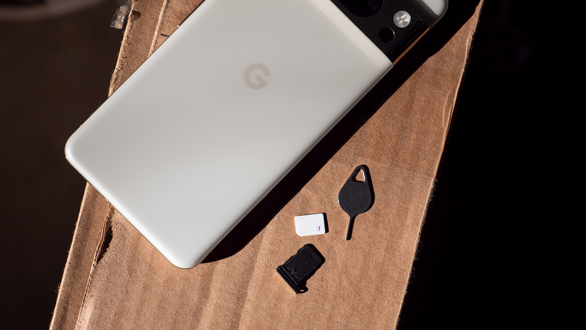 A T-Mobile SIM card with a Google Pixel 8 Pro