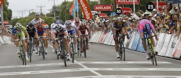 Andre Greipel (Lotto Belisol) wins stage one of the Santos Tour Down Under from Alessandro Petacchi (Lampre-ISD).