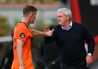 Steve Bruce, Manager of Newcastle United with Sean Longstaff at full time during the Premier League match between AFC Bournemouth and Newcastle United at Vitality Stadium on July 01, 2020 in Bournemouth, England. Football Stadiums around Europe remain empty due to the Coronavirus Pandemic as Government social distancing laws prohibit fans inside venues resulting in all fixtures being played behind closed doors.