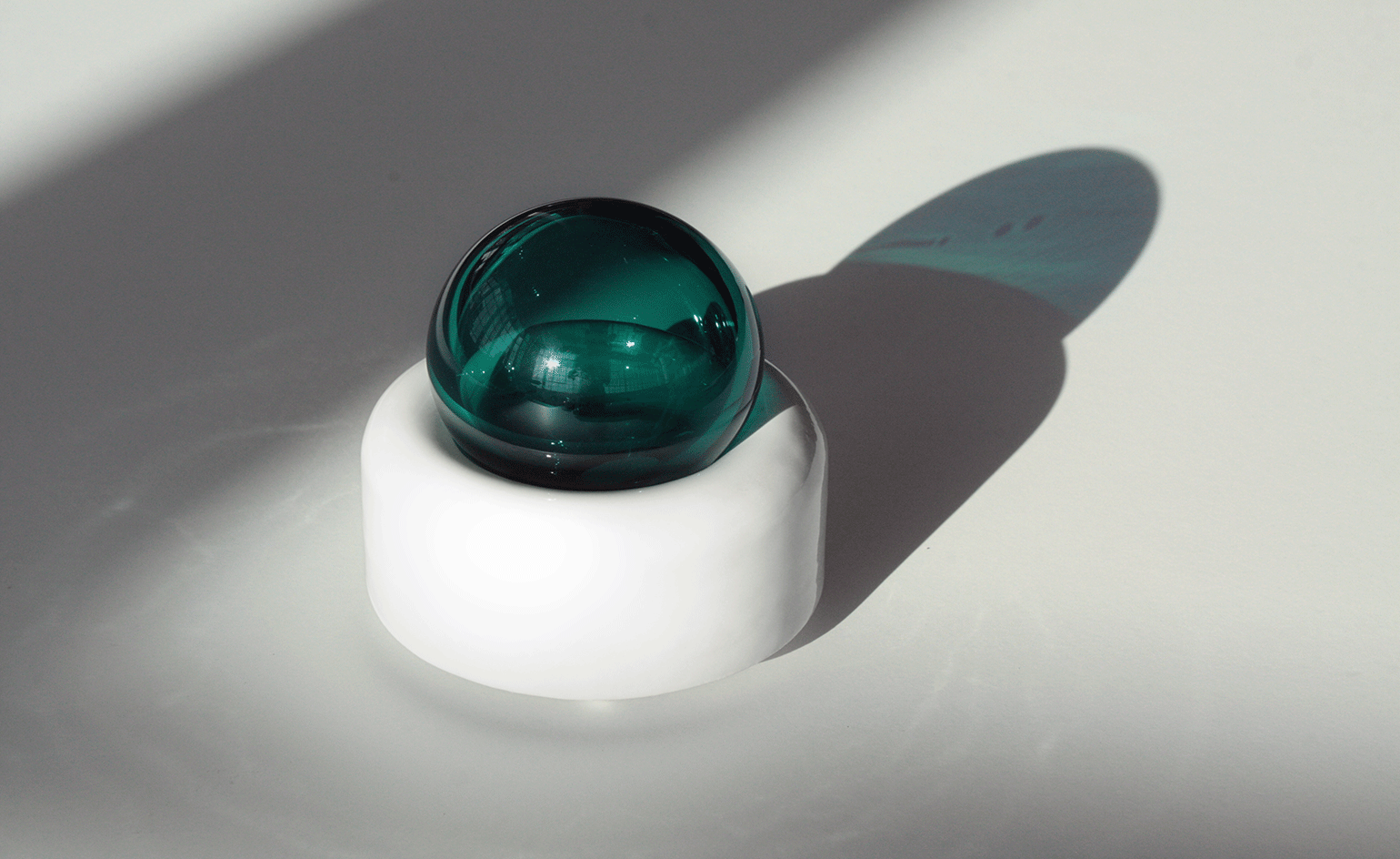 A blown-glass ball top and a scooped, slip-cast ceramic base