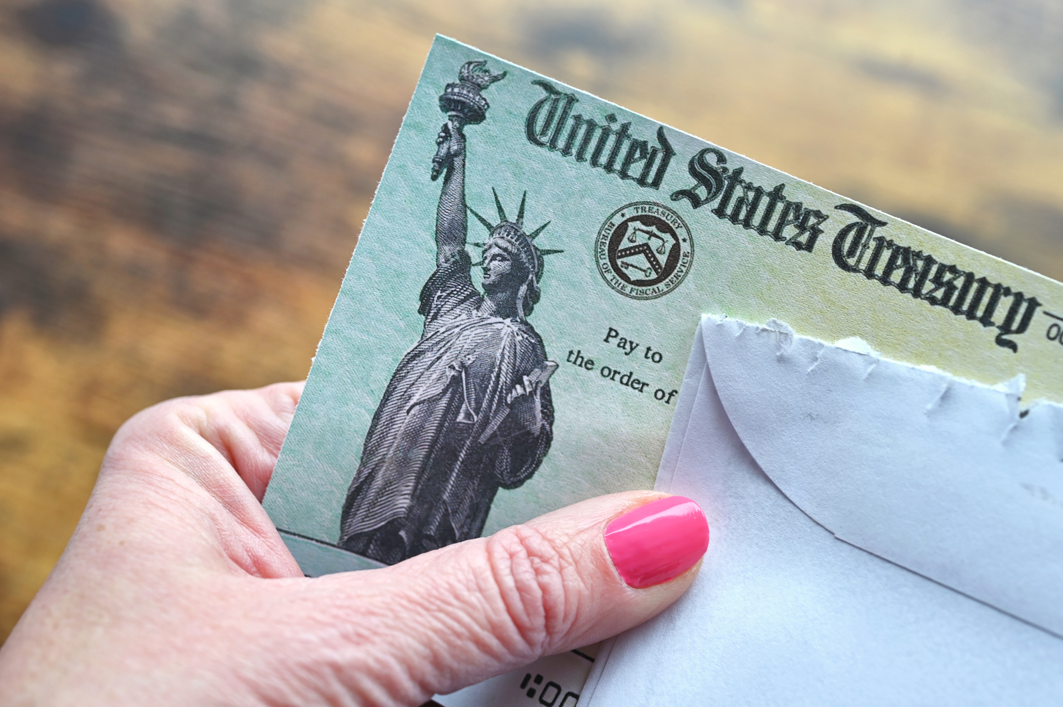 Woman holding a SS check
