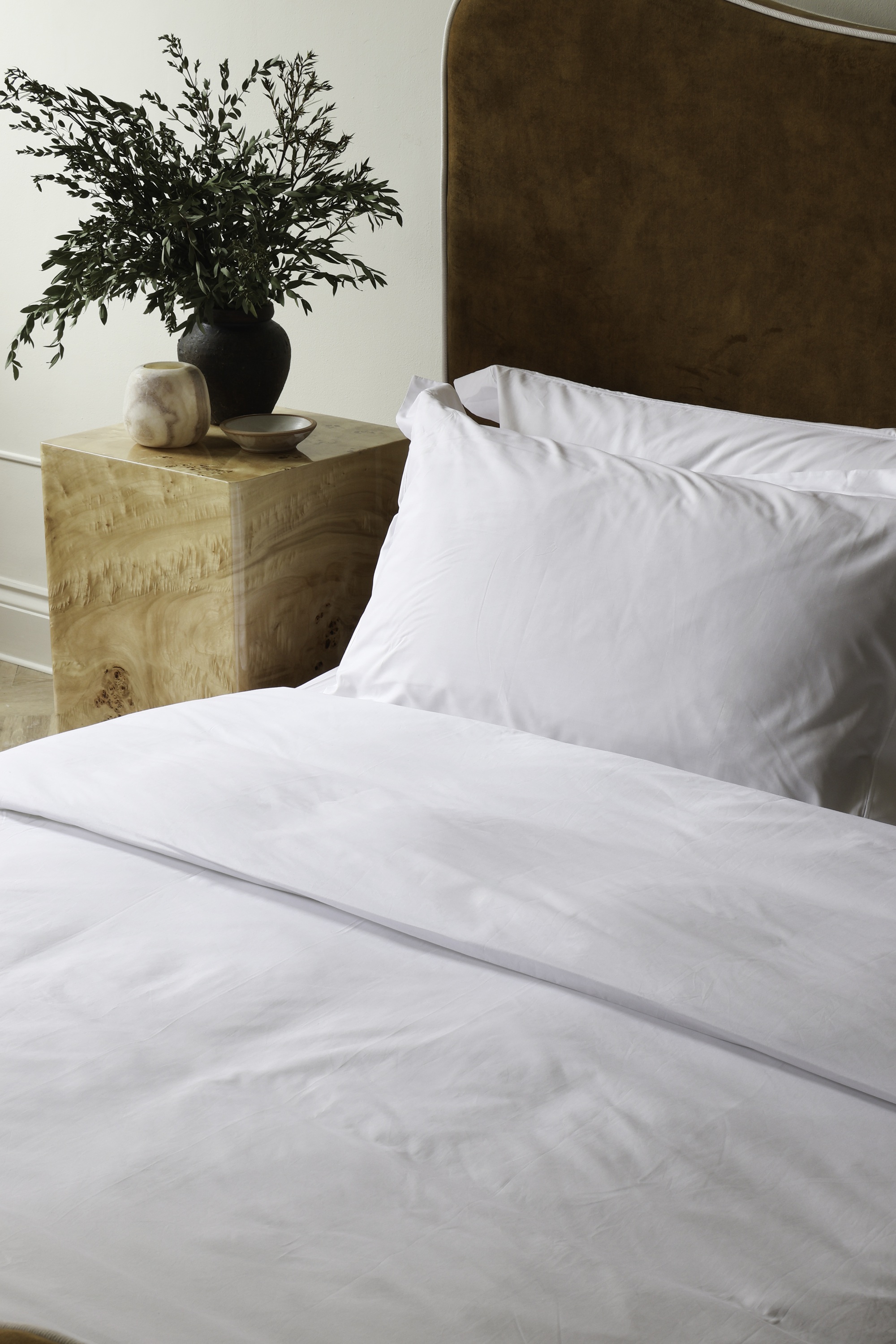 white company bedding on a bed