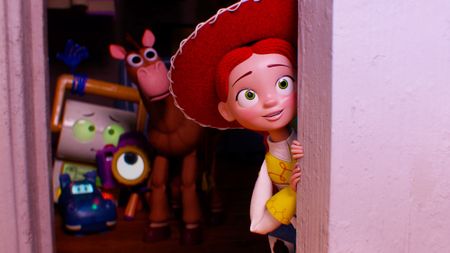 Jessie smiling as she peers from behind a door as Smarty Pants, Atlas, Snappy, and Bullseye watch on in Toy Story 5