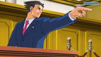 An image of character Phoenix Wright in the courtroom. He is adopting his signature, raised finger "Objection!" pose.
