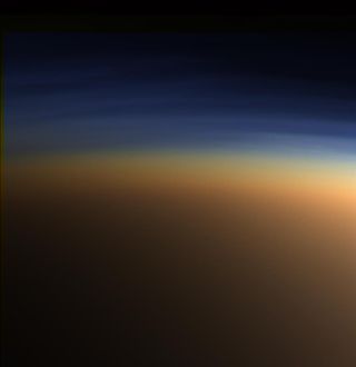 This natural-color image by NASA’s Cassini spacecraft shows the Saturn moon Titan's upper atmosphere — an active place where methane molecules are being broken apart by solar ultraviolet light, and the byproducts combine to form compounds like ethane and acetylene.