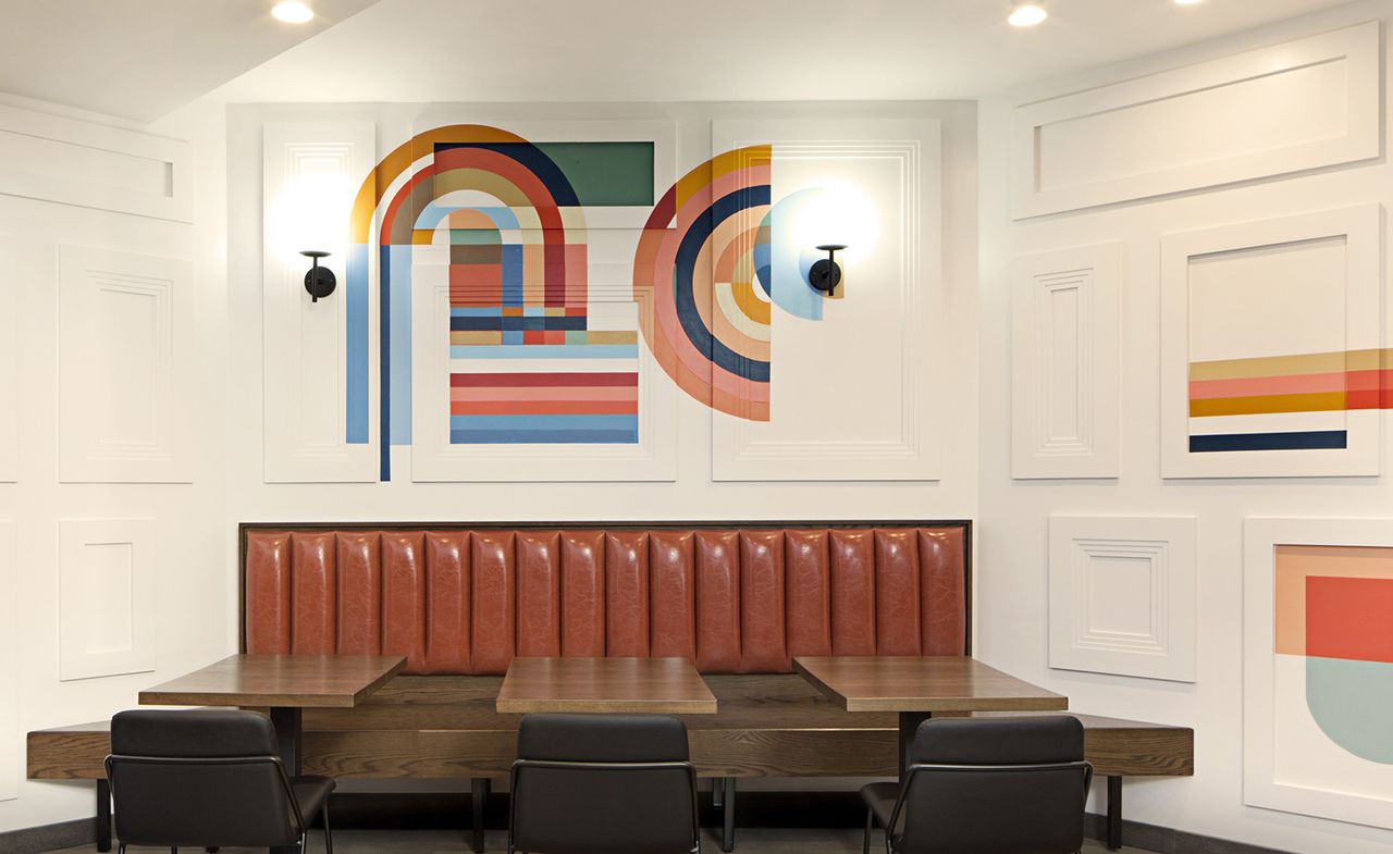 restaurant with white wall and wooden table