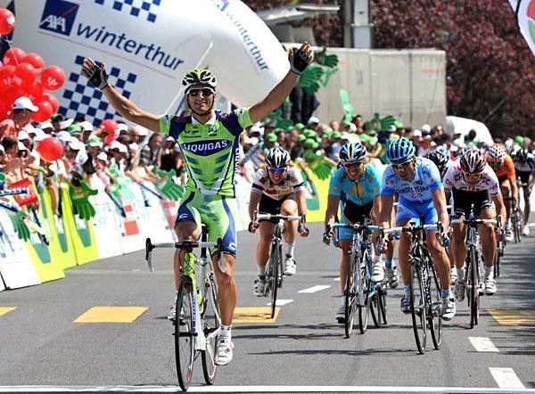 A smiling Bennati crosses the line in first.