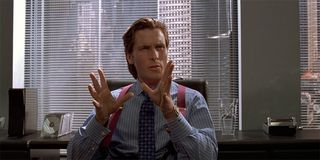 American Psycho Christian Bale as Patrick Bateman at desk
