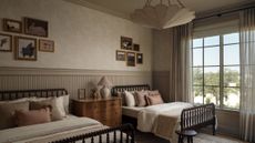 Whimsical double-dressed children's room featuring two beds, a floral light treatment, and collected art