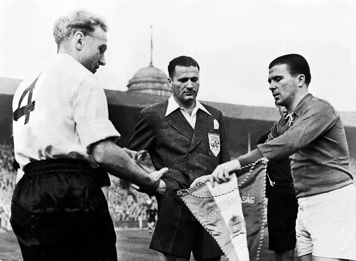 England captain Billy Wright and Hungary captain Ferenc Puskas exchange pennants ahead of the international match at Wembley Stadium, November 1953
