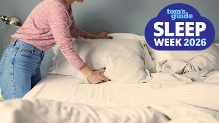 A woman in blue jeans and a pink sweater makes her bed as part of her nighttime routine. In the top right foreground, a Sleep Week 2026 badge can be seen. 