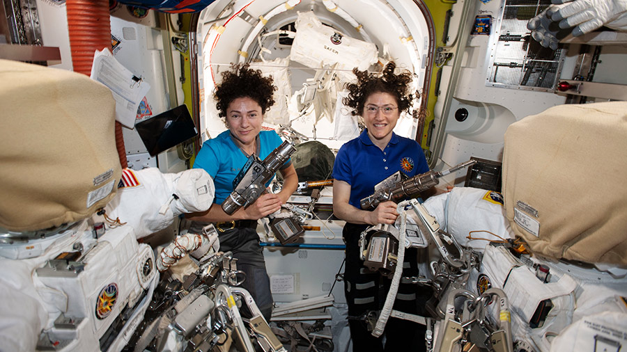 NASA astronauts Christina Koch (right) and Jessica Meir pose with their spacesuits for an October 2019 spacewalk, the first all-woman spacewalk in history.