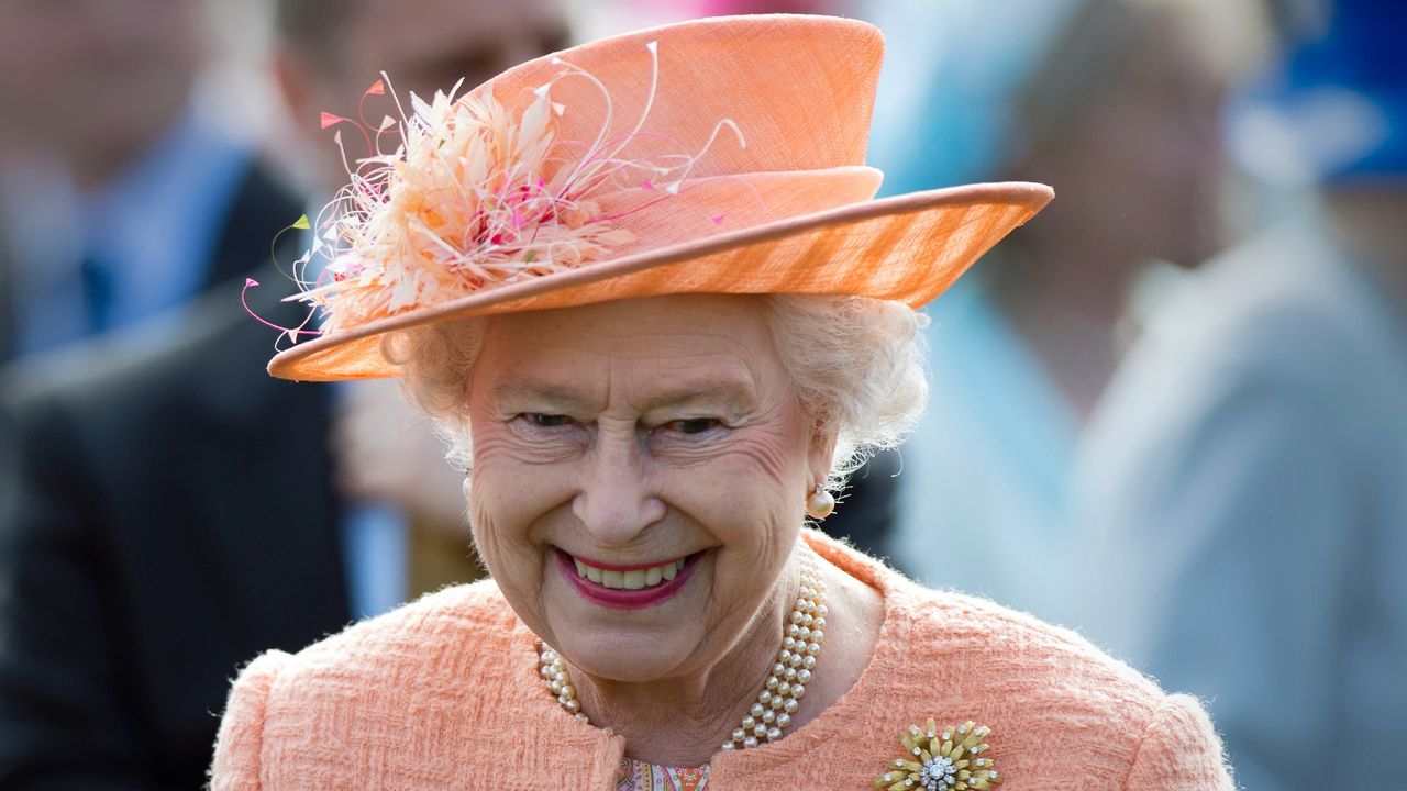 Queen Elizabeth II greets guests during a garden party in honour of her Diamond Jubilee at the Queen&#039;s Sandringham Estate