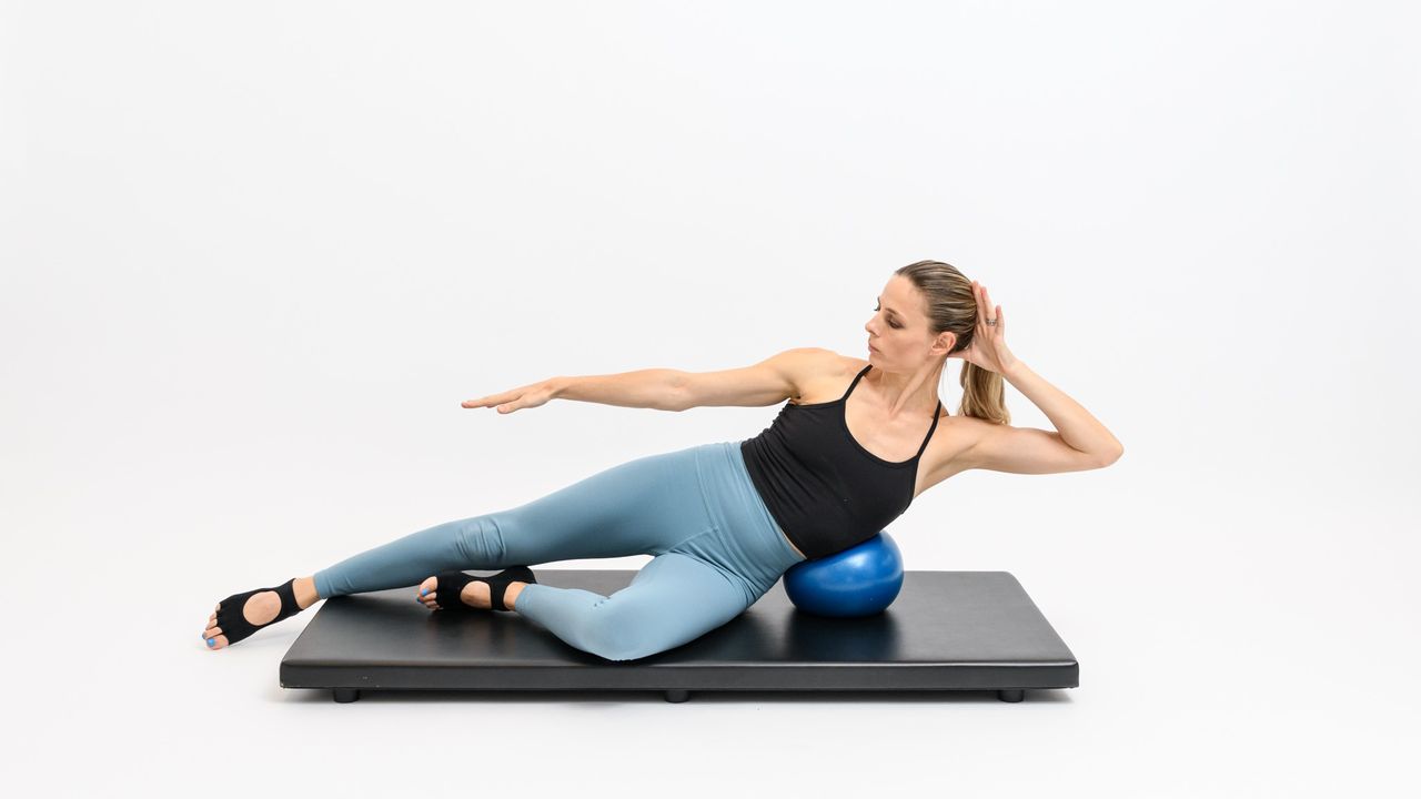 a photo of a woman doing a side bend