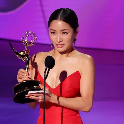 Anna Sawai accepts her award at the 2024 Emmys.