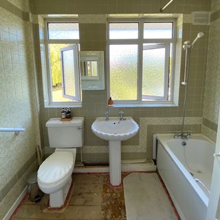 bathroom with green tiles