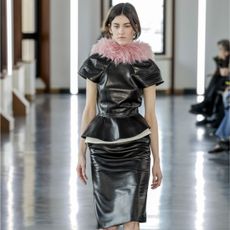 Peplum tops on the runway: A model walks the runway during the Bally Ready to Wear Fall/Winter 2025-2026 fashion show as part of the Milan Fashion Week on March 1, 2025 in Milan, Italy.
