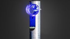 A close up of a glass chamber with a blue glow mounted on a metal pole.