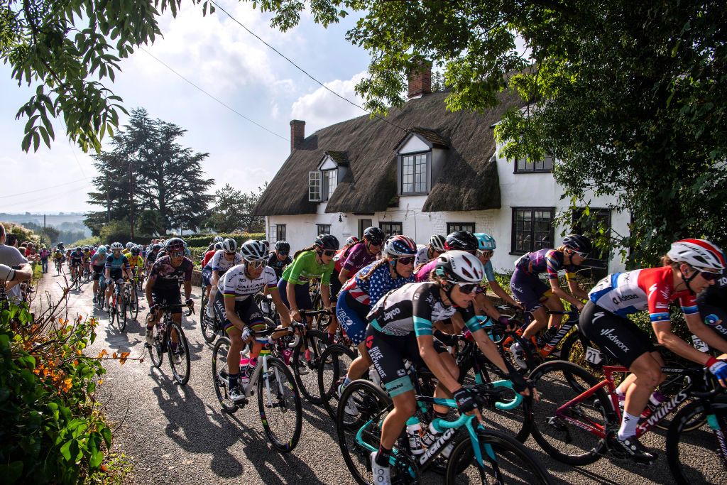 FELIXSTOWE ENGLAND OCTOBER 09 LR Elisa Balsamo of Italy and Team Valcar Travel Service Lauren Stephens of United States and Team TIBCO Silicon Valley Bank Ane Santesteban Gonzalez of Spain and Team BikeExchange and Amy Pieters of Netherlands lead the peloton passing through Glemsford Village in Suffolk during the 7th The Womens Tour 2021 Stage 6 a 160km stage from Haverhill to Felixstowe thewomenstour UCIWWT on October 09 2021 in Felixstowe England Photo by Justin SetterfieldGetty Images