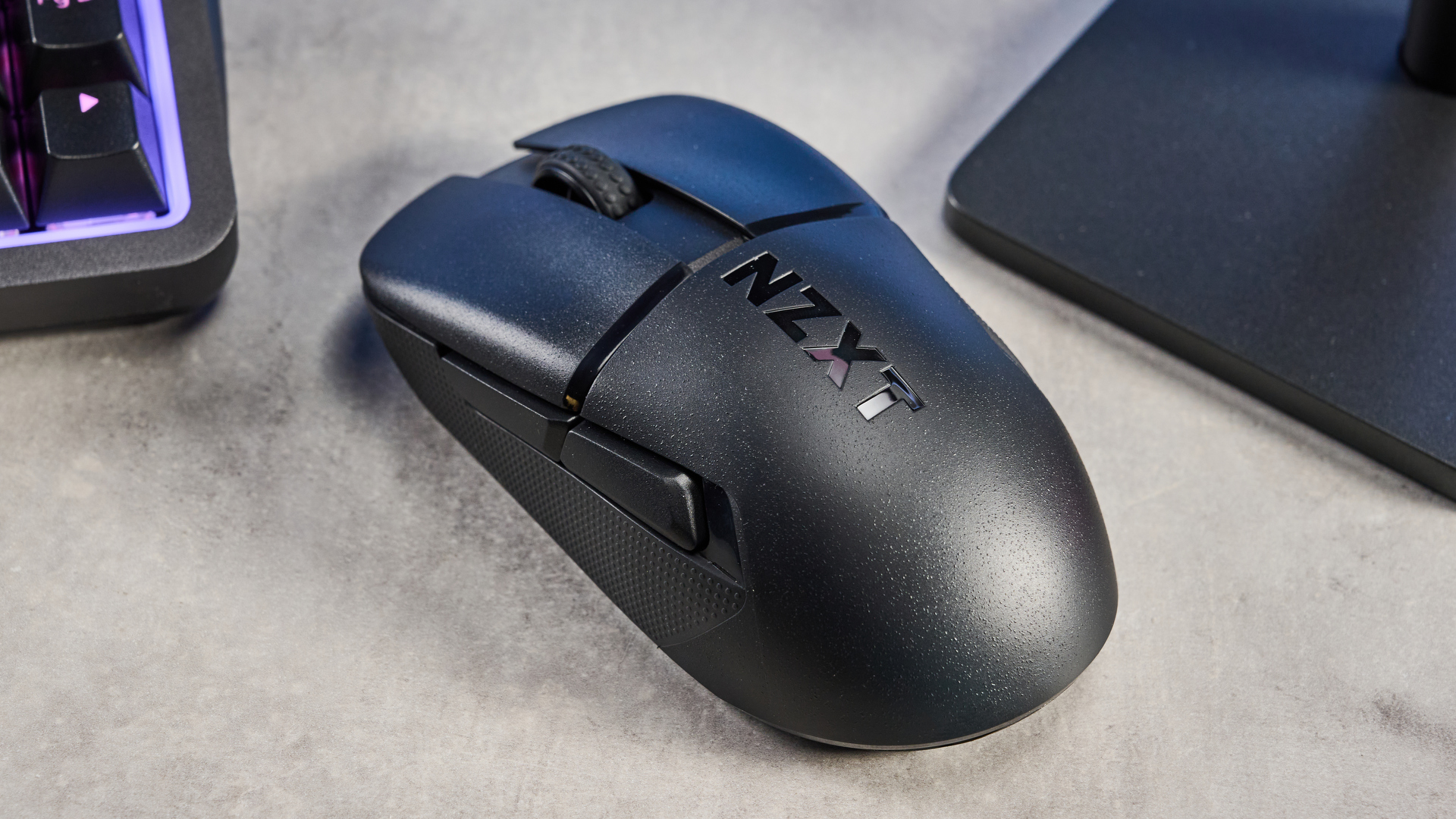 A black NZXT Lift Elite Wireless gaming mouse