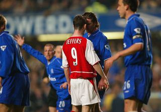 Francis Jeffers of Arsenal goes head to head with Emmanuel Petit of Chelsea during the FA Cup Quarter Final Replay match between Chelsea and Arsenal at Stamford Bridge in London on March 25, 2003.